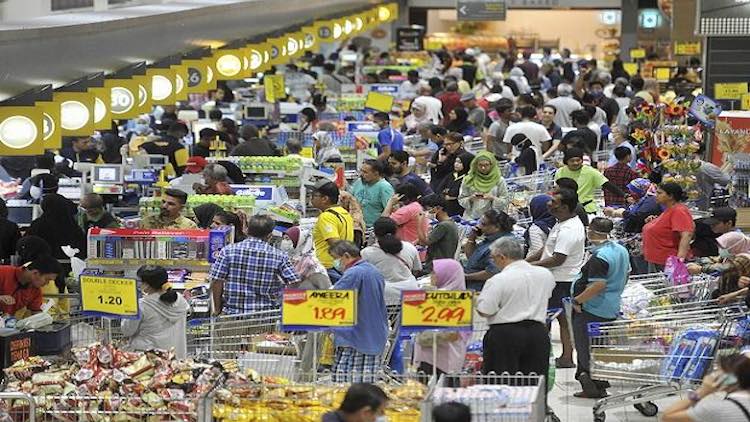 People Stock Up On Essentials As Lockdown Fear Tak